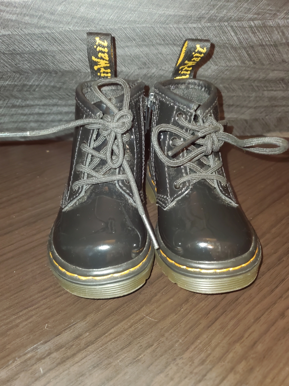 Dr. Martens Black Patent Kids Lace-Up Boots with Yellow Stitching